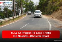 ₹1.12 Cr Project to Ease Traffic on Nainital–Bhowali Road A view of vehicles driving along the curved Nainital–Bhowali road surrounded by trees, highlighting the ₹1.12 crore project aimed at easing traffic in the hilly region.