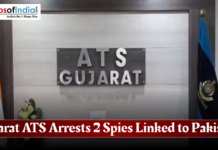 Gujarat ATS Arrests 2 Spies Linked to Pakistan Gujarat ATS office signage with Indian and police flags, accompanied by a headline stating the arrest of two spies linked to Pakistan.