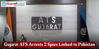 Gujarat ATS Arrests 2 Spies Linked to Pakistan Gujarat ATS office signage with Indian and police flags, accompanied by a headline stating the arrest of two spies linked to Pakistan.