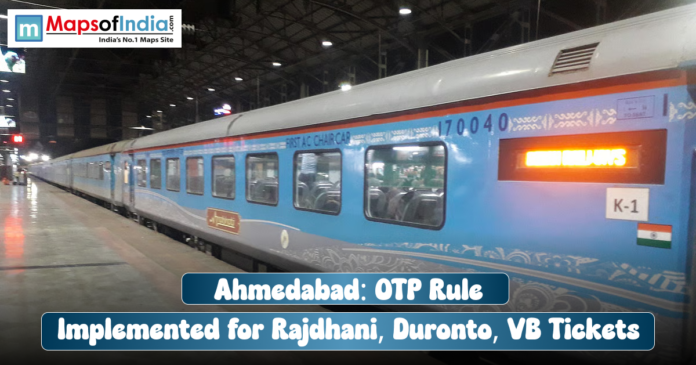 A blue and grey train (Rajdhani Express) car at a station platform, with a text overlay reading: 