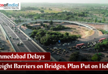 Ahmedabad Delays Height Barriers on Bridges, Plan Put on Hold Aerial view of a busy Ahmedabad flyover and road junction with vehicles in motion, featuring a headline reading “Ahmedabad Delays Height Barriers on Bridges, Plan Put on Hold” and the Maps of India logo.