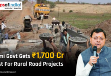Dhami Govt Gets ₹1,700 Cr Boost for Rural Road Projects Dhami government announces ₹1,700 crore boost for rural road projects, with workers constructing a rural road and a photo of Pushkar Singh Dhami