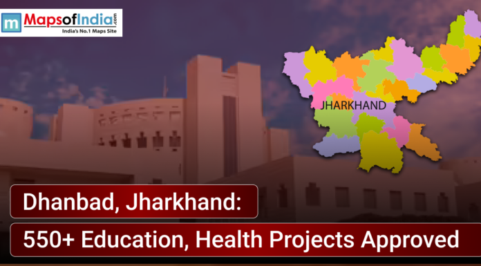 Dhanbad, Jharkhand: 550+ Education, Health Projects Approved News graphic showing Dhanbad, Jharkhand, with a district map of Jharkhand highlighted and text announcing approval of 550+ education and health projects, alongside a government building in the background.