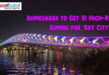 Ahmedabad to Get 31 High-Rises, Aiming for ‘Sky City’ Tag Night view of Ahmedabad’s illuminated footbridge over the Sabarmati River with colorful lights, highlighting news about the city planning 31 new high-rise buildings to earn the ‘Sky City’ tag.