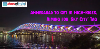 Ahmedabad to Get 31 High-Rises, Aiming for ‘Sky City’ Tag Night view of Ahmedabad’s illuminated footbridge over the Sabarmati River with colorful lights, highlighting news about the city planning 31 new high-rise buildings to earn the ‘Sky City’ tag.