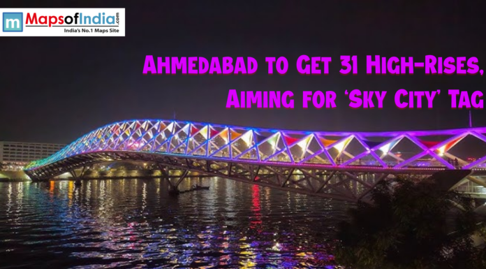 Ahmedabad to Get 31 High-Rises, Aiming for ‘Sky City’ Tag Night view of Ahmedabad’s illuminated footbridge over the Sabarmati River with colorful lights, highlighting news about the city planning 31 new high-rise buildings to earn the ‘Sky City’ tag.