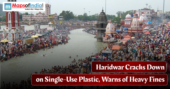 Haridwar Crowded Haridwar ghats along the Ganga River with temples and devotees, highlighting the city’s crackdown on single-use plastic and warning of heavy fines.