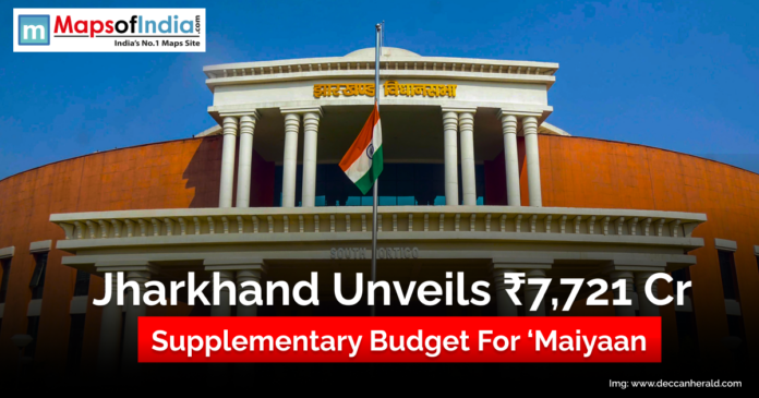 Front view of the Jharkhand Legislative Assembly building with the Indian flag in front, featuring a headline that reads ‘Jharkhand Unveils ₹7,721 Cr Supplementary Budget for Maiyaan’, along with the Maps of India logo at the top.