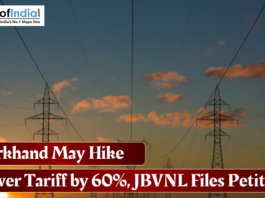 Electricity transmission towers at sunset with headline about Jharkhand's proposed 60% power tariff hike.