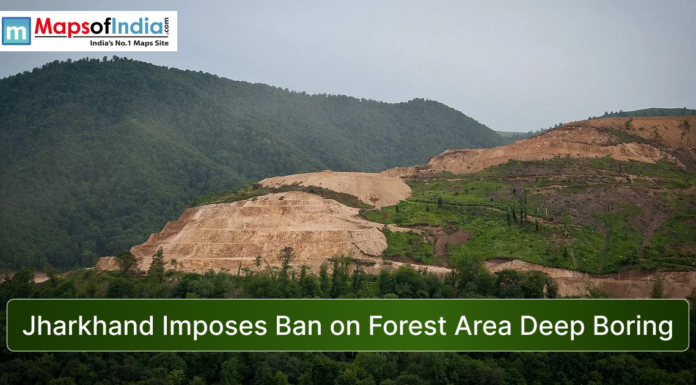 Jharkhand Imposes Ban on Forest Area Deep Boring Forested hills in Jharkhand with a large deforested slope and excavation area, showing environmental impact alongside the headline “Jharkhand Imposes Ban on Forest Area Deep Boring” and Maps of India logo.