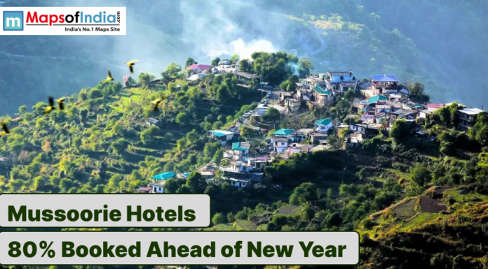 Mussoorie Hotels 80% Booked Ahead of New Year Hilltop view of Mussoorie town with hotels amid lush green mountains.