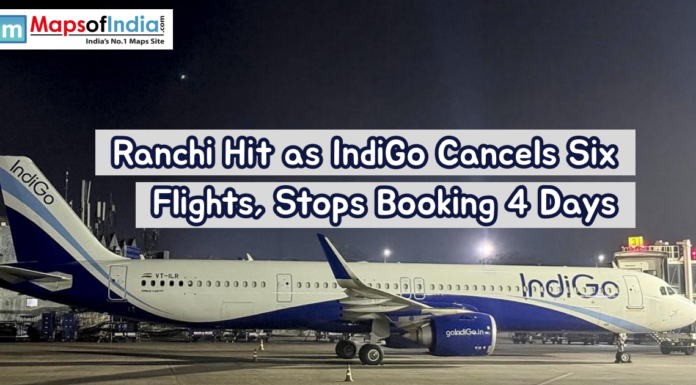 Ranchi Hit as IndiGo Cancels Six Flights, Stops Booking 4 Days An IndiGo aircraft parked on an airport tarmac at night, illuminated by runway lights. A headline overlay reports flight cancellations and halted bookings in Ranchi.