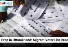 SIR Prep in Uttarakhand: Migrant Voter List Readied Hands sorting through printed voter lists during preparations in Uttarakhand for the migrant voter registry.