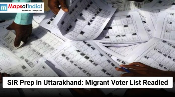 SIR Prep in Uttarakhand: Migrant Voter List Readied Hands sorting through printed voter lists during preparations in Uttarakhand for the migrant voter registry.