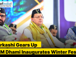 Pushkar Singh Dhami sitting on a stage with his ministers