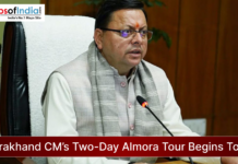 Uttarakhand CM’s Two-Day Almora Tour Begins Today Uttarakhand Chief Minister seated at a desk during an official meeting, speaking into a microphone, with the headline “Uttarakhand CM’s Two-Day Almora Tour Begins Today” and Maps of India logo displayed.
