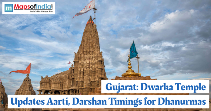 gujarat(1) Dwarka Temple in Gujarat with its towering shikhara and flags fluttering, highlighting updated Aarti and Darshan timings for the Dhanurmas period.