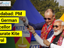 Two political leaders flying kites at an outdoor event in Ahmedabad, with colorful kites in the background and on-image text announcing the inauguration of a kite festival, alongside the Maps of India logo.