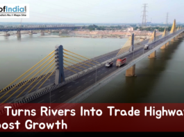 Aerial view of a modern cable-stayed bridge spanning a wide river in Bihar, with trucks and vehicles crossing, showcasing waterways and infrastructure development aimed at boosting trade and economic growth.