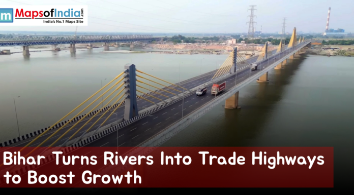 Bihar Turns Rivers Into Trade Highways to Boost Growth Aerial view of a modern cable-stayed bridge spanning a wide river in Bihar, with trucks and vehicles crossing, showcasing waterways and infrastructure development aimed at boosting trade and economic growth.