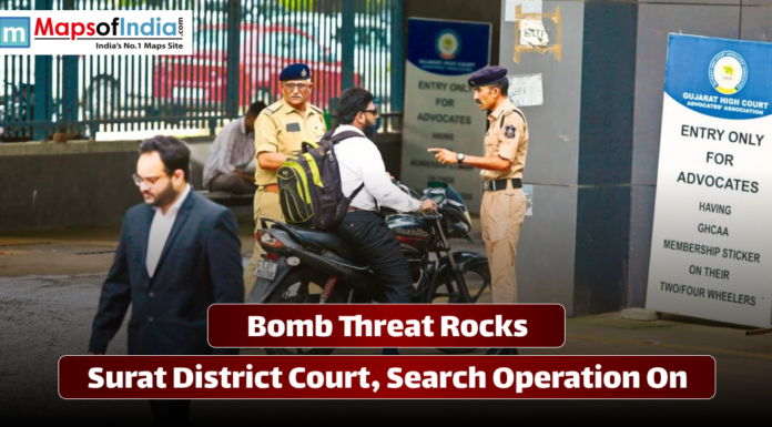 Bomb Threat Rocks Surat District Court, Search Operation On Police checking vehicles and people outside Surat District Court after a bomb threat, with security heightened and a search operation underway.
