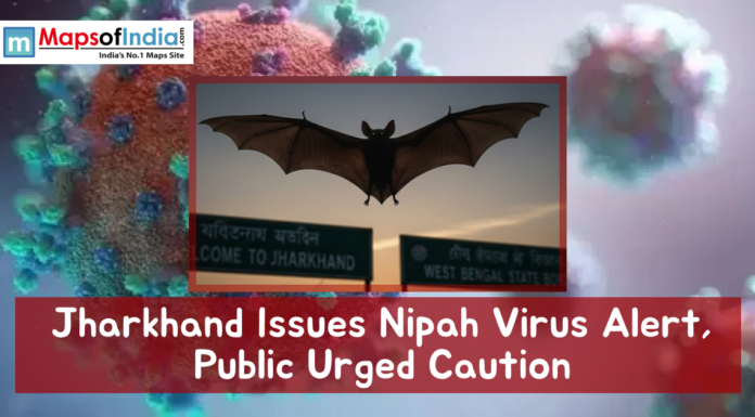 Jharkhand Issues Nipah Virus Alert, Public Urged Caution Illustration showing a bat in flight with virus graphics and a headline reading “Jharkhand Issues Nipah Virus Alert, Public Urged Caution,” symbolizing a public health warning.