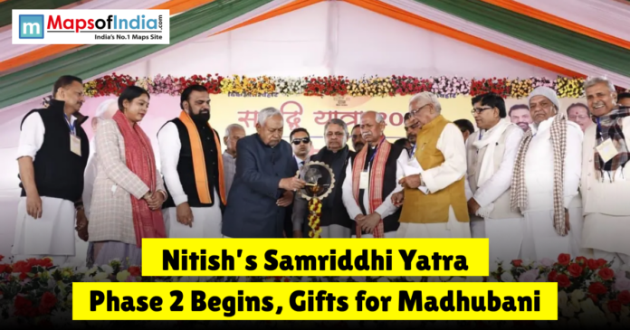 Nitish,s Samriddhi yatra Nitish Kumar reviewing development projects at a stall with a text overlay reading