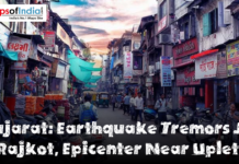 Gujarat: Earthquake Tremors Jolt Rajkot, Epicenter Near Upleta Busy street market in Rajkot, Gujarat, with shops, pedestrians, motorcycles, and signboards lining a narrow road, featuring a headline that reads ‘Gujarat: Earthquake Tremors Jolt Rajkot, Epicenter Near Upleta.’