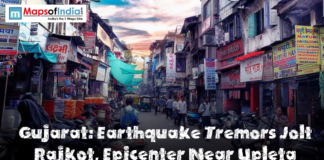 Gujarat: Earthquake Tremors Jolt Rajkot, Epicenter Near Upleta Busy street market in Rajkot, Gujarat, with shops, pedestrians, motorcycles, and signboards lining a narrow road, featuring a headline that reads ‘Gujarat: Earthquake Tremors Jolt Rajkot, Epicenter Near Upleta.’