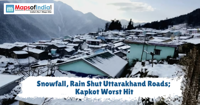 Snow-covered houses in a mountain village with a text overlay reading 