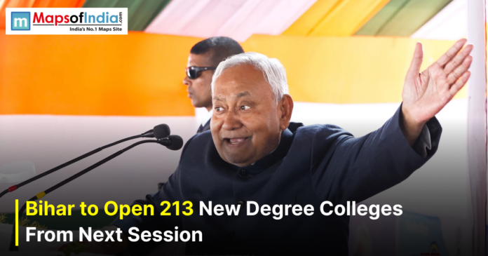 A photo of Bihar Chief Minister Nitish Kumar speaking at a podium with one arm raised.