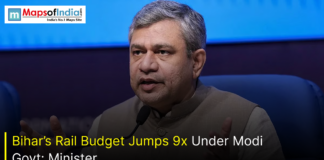 Bihar’s Rail Budget Jumps 9x Under Modi Govt: Minister A senior Indian government minister speaking at a press conference, with a banner reading “Bihar’s Rail Budget Jumps 9x Under Modi Govt: Minister,” highlighting a major increase in railway funding for Bihar.