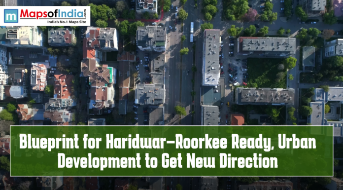 Blueprint for Haridwar–Roorkee Ready, Urban Development to Get New Direction Aerial view of a cityscape with roads, buildings, and green spaces, featuring text overlay “Blueprint for Haridwar–Roorkee Ready, Urban Development to Get New Direction” and the Maps of India logo.