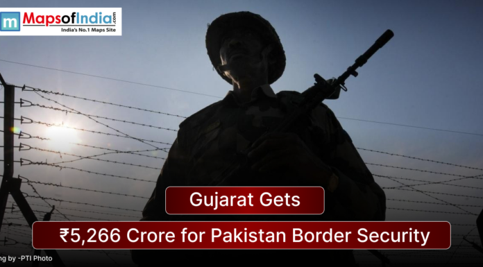 Gujarat Gets ₹5,266 Crore for Pakistan Border Security Silhouette of an armed Indian border security personnel standing near a barbed wire fence at sunset, with a headline overlay reading “Gujarat Gets ₹5,266 Crore for Pakistan Border Security” and Maps of India logo in the corner