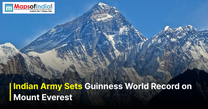 Indian Army sets a Guinness World Record on Mount Everest, with a clear view of the snow-covered Everest peak under a blue sky.