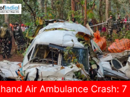 Rescue teams and security personnel inspect the wreckage of a crashed air ambulance in a forested area in Jharkhand