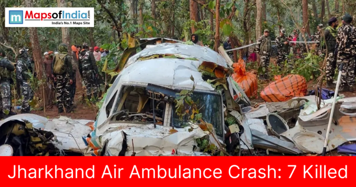 Rescue teams and security personnel inspect the wreckage of a crashed air ambulance in a forested area in Jharkhand