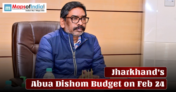 A man seated at an office desk during a meeting, with text overlay reading “Jharkhand’s Abua Dishom Budget on Feb 24.