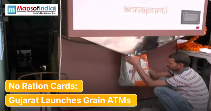 Man collecting a bag of food grains from an Annapurti grain ATM machine in Gujarat, highlighting the launch of ration-free distribution.