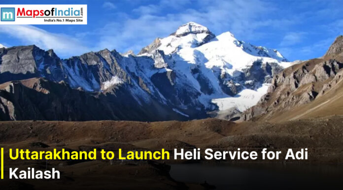 Uttarakhand to Launch Heli Service for Adi Kailash Snow-capped Adi Kailash peak in Uttarakhand under a clear blue sky with text overlay reading “Uttarakhand to Launch Heli Service for Adi Kailash” and Maps of India logo in the corner.
