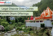 Legal Dispute Over Crores in Kainchi Dham Offerings Kainchi Dham temple complex in Uttarakhand surrounded by green hills and a flowing stream, highlighting a legal dispute over crores in offerings