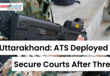 Uttarakhand: ATS Deployed to Secure Courts After Threat Armed security personnel with rifle and text overlay reading “Uttarakhand: ATS Deployed to Secure Courts After Threat” with Maps of India logo.