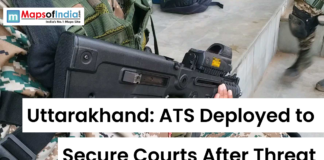 Uttarakhand: ATS Deployed to Secure Courts After Threat Armed security personnel with rifle and text overlay reading “Uttarakhand: ATS Deployed to Secure Courts After Threat” with Maps of India logo.