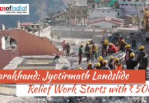 Uttarakhand: Jyotirmath Landslide Relief Work Starts with ₹500 Cr Rescue workers wearing helmets clear debris at a landslide-affected site in Jyotirmath, Uttarakhand, with damaged buildings in the background and headline about ₹500 crore relief work.