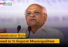Administrator Rule Imposed in 71 Gujarat Municipalities Political leader speaking at a podium during an announcement about administrator rule imposed in 71 Gujarat municipalities