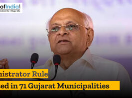 Political leader speaking at a podium during an announcement about administrator rule imposed in 71 Gujarat municipalities