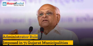 Administrator Rule Imposed in 71 Gujarat Municipalities Political leader speaking at a podium during an announcement about administrator rule imposed in 71 Gujarat municipalities