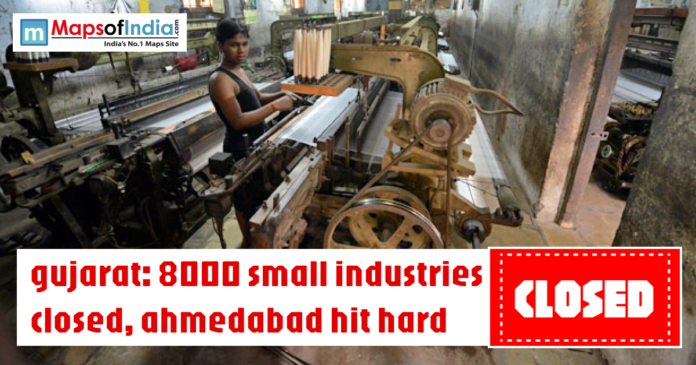 Worker operating textile machinery in a small factory with headline about 8000 small industries closed in Gujarat