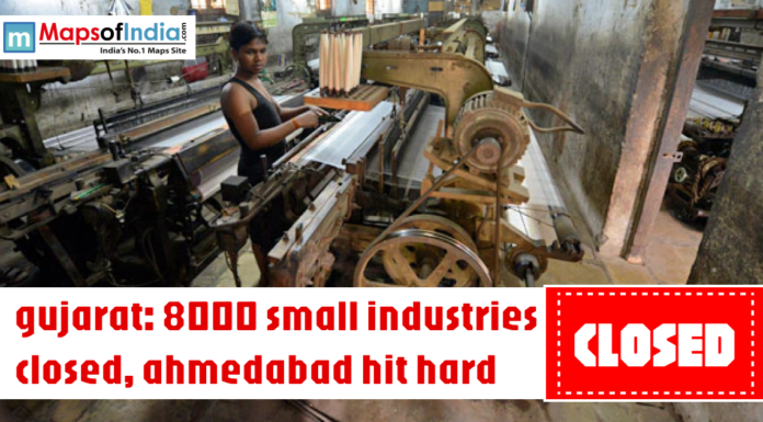 Gujarat: 8000 Small Industries Closed, Ahmedabad Hit Hard Worker operating textile machinery in a small factory with headline about 8000 small industries closed in Gujarat