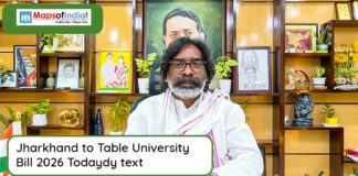 Jharkhand to Table University Bill 2026 Today Man seated at a desk addressing media about Jharkhand University Bill 2026, with framed photos and decor in the background